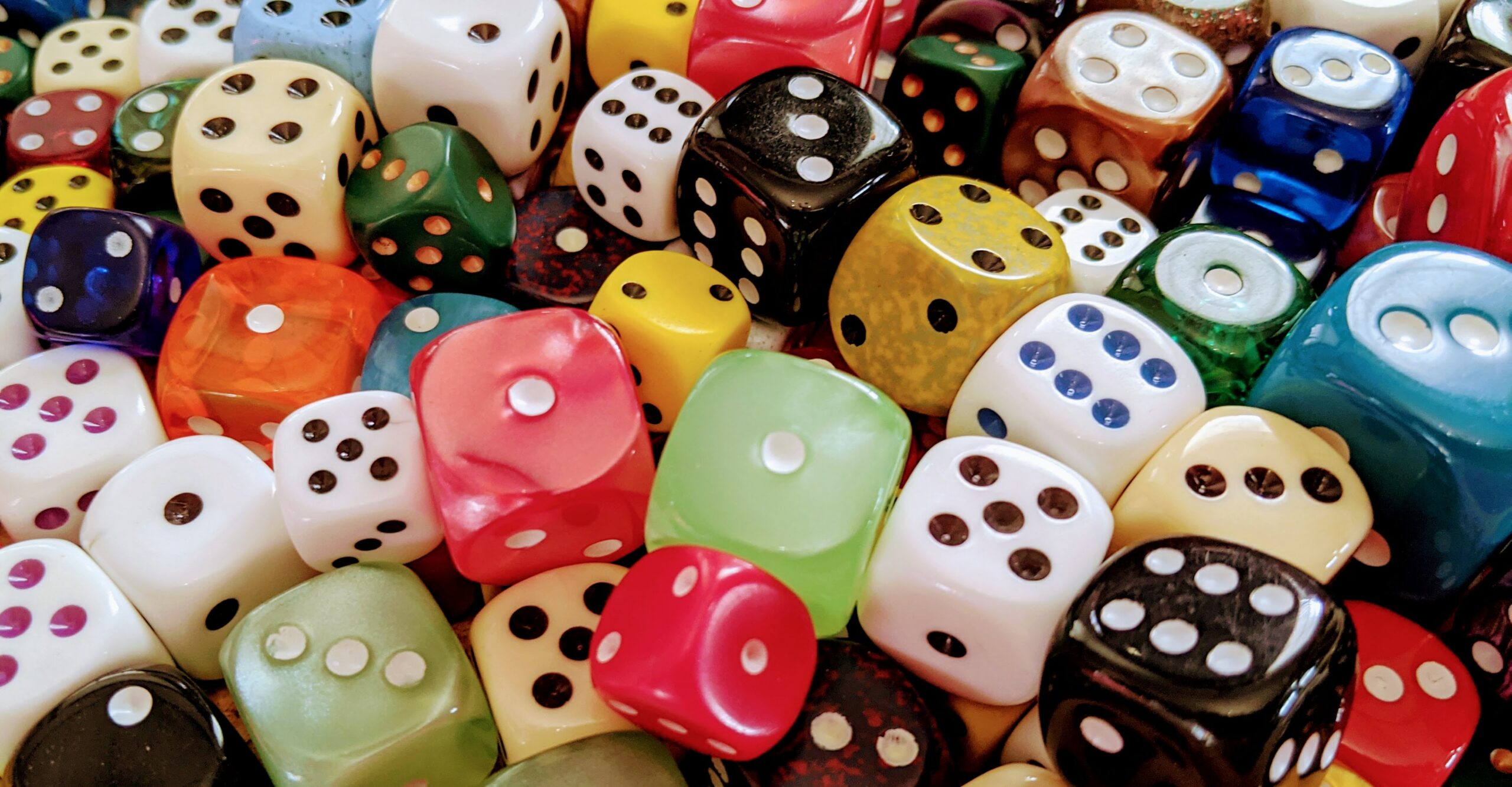 8 Reasons to Get Tested for Celiac Disease image of mixture of die (dice) in various sizes and colors to represent risk factors.